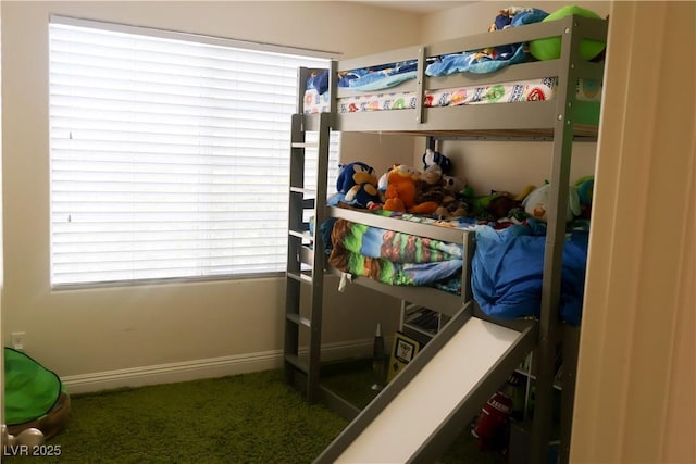 bedroom with carpet flooring and baseboards