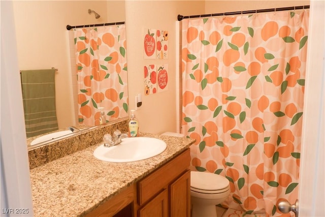 bathroom with toilet, vanity, and a shower with curtain