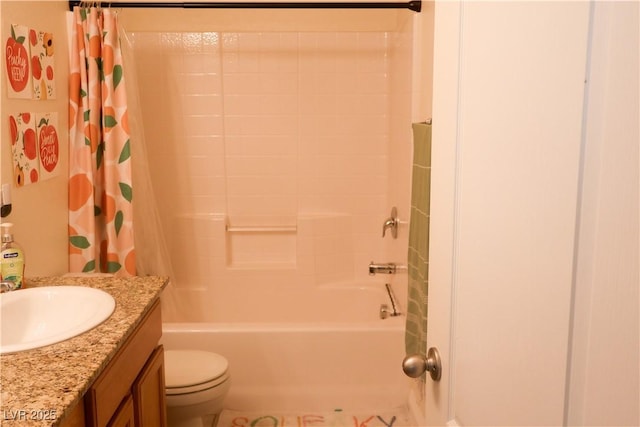 full bathroom with vanity, shower / bath combination with curtain, and toilet