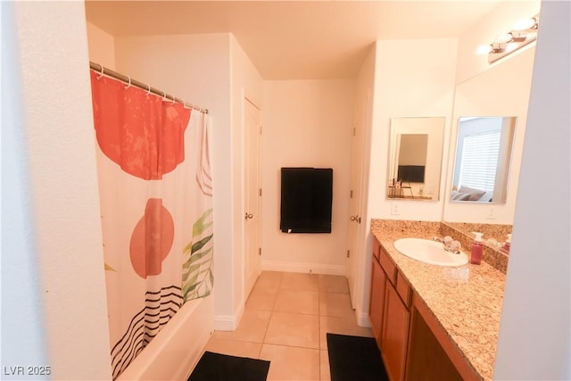 bathroom featuring shower / tub combo with curtain, tile patterned floors, baseboards, and vanity