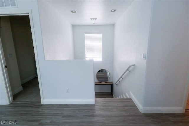 staircase featuring baseboards, visible vents, recessed lighting, and wood finished floors