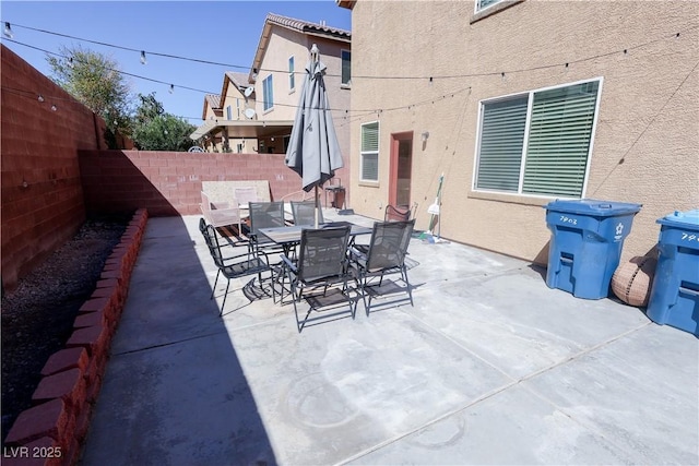 view of patio featuring a fenced backyard and outdoor dining area