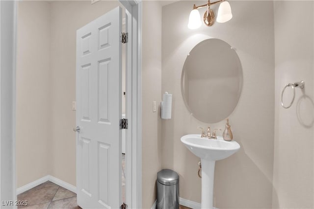 bathroom featuring baseboards and tile patterned floors