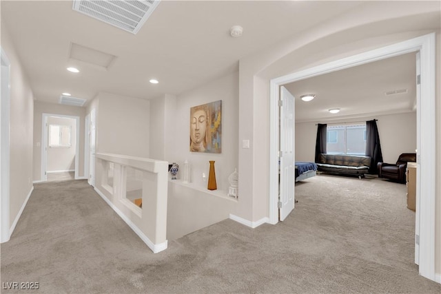 corridor featuring attic access, visible vents, an upstairs landing, carpet floors, and recessed lighting