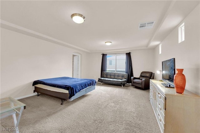 bedroom featuring light carpet, visible vents, and baseboards