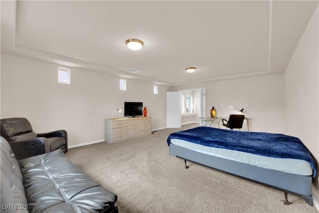 carpeted bedroom featuring visible vents and baseboards