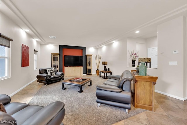 living area with tile patterned flooring, visible vents, baseboards, and recessed lighting