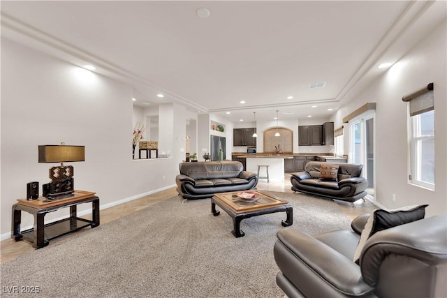 living area with light tile patterned floors, visible vents, baseboards, and recessed lighting