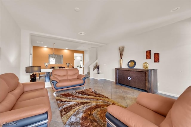 living area with tile patterned flooring, stairway, baseboards, and recessed lighting