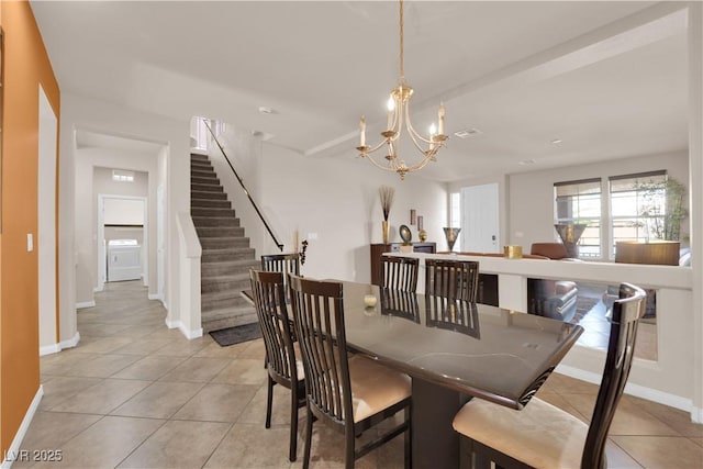 dining room with visible vents, an inviting chandelier, light tile patterned flooring, baseboards, and stairs