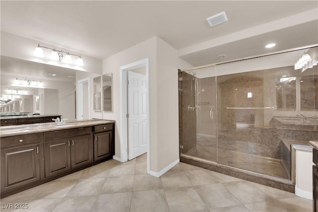 bathroom featuring a shower stall, visible vents, baseboards, and vanity