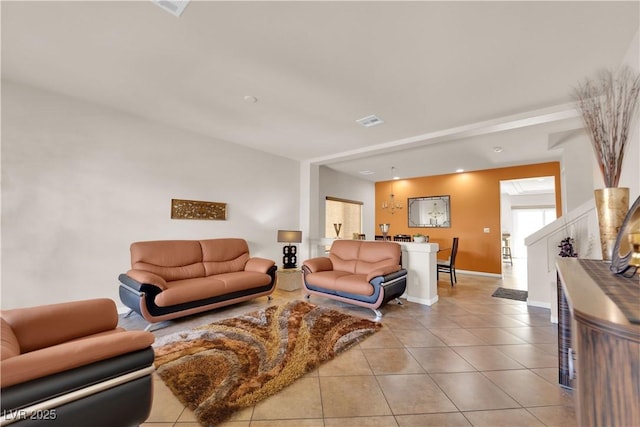 tiled living area featuring baseboards