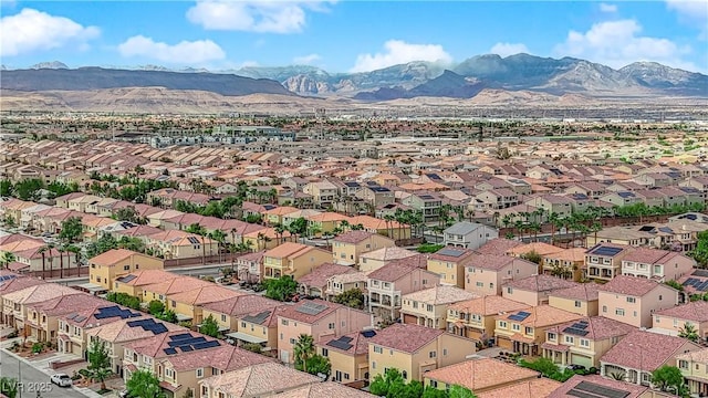 aerial view featuring a mountain view and a residential view