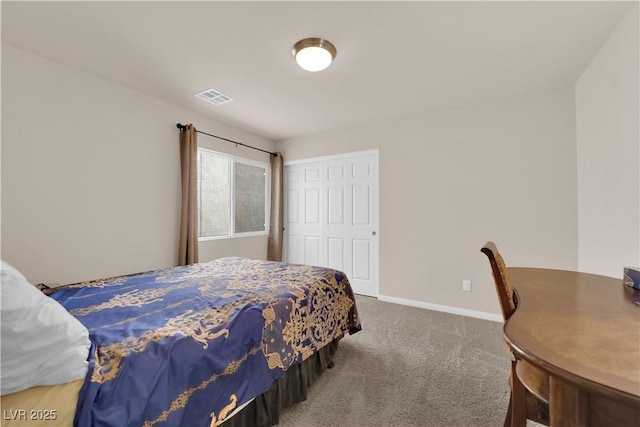 bedroom featuring a closet, carpet flooring, visible vents, and baseboards