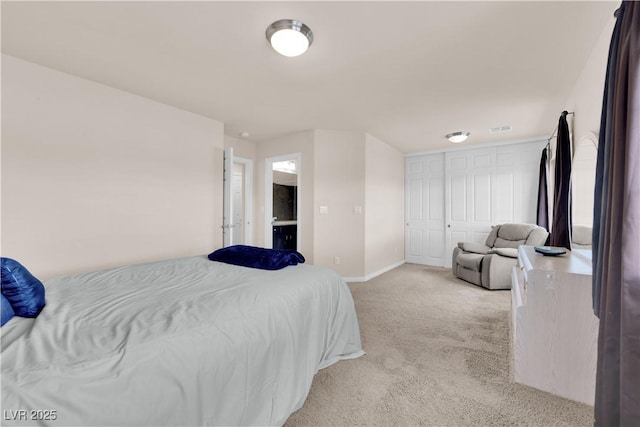 bedroom featuring light carpet, visible vents, and baseboards