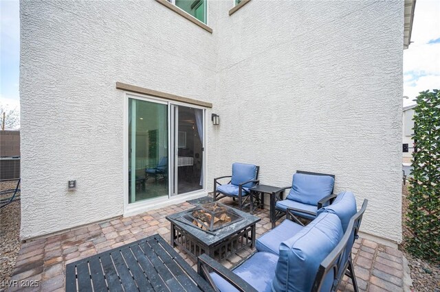 view of patio with an outdoor fire pit