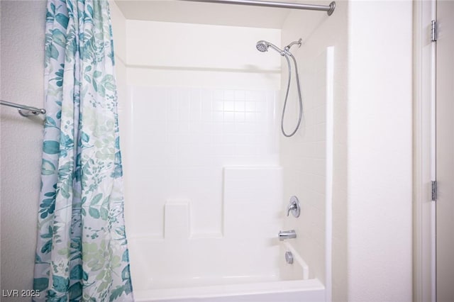 bathroom with shower / bathtub combination with curtain