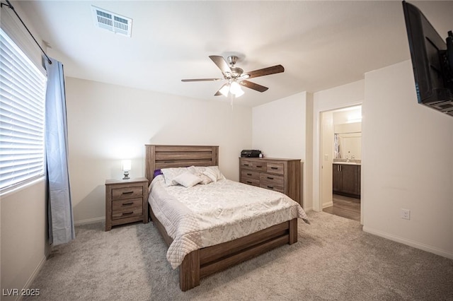 bedroom with light carpet, baseboards, visible vents, and ceiling fan