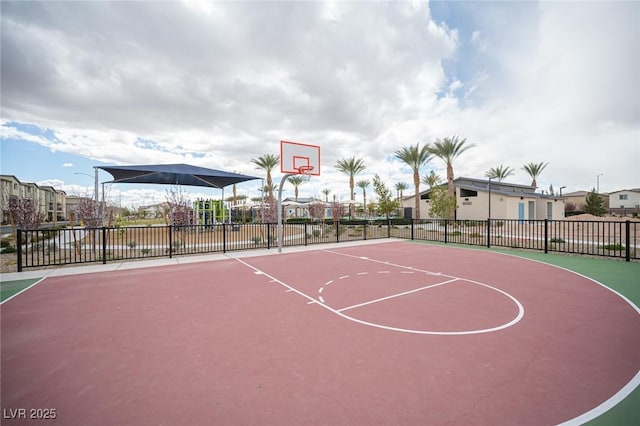 view of basketball court featuring community basketball court and fence