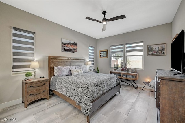 bedroom featuring a ceiling fan and baseboards