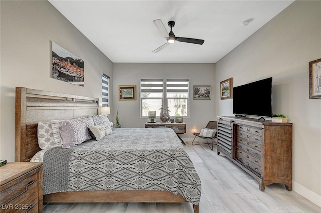 bedroom with baseboards and a ceiling fan