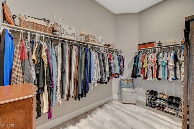 spacious closet featuring wood finished floors