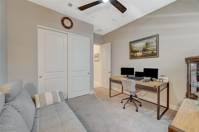 office area with carpet flooring, visible vents, a ceiling fan, vaulted ceiling, and baseboards