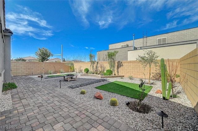 view of patio / terrace featuring a fire pit and a fenced backyard