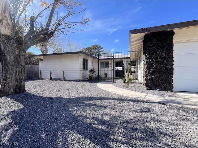 view of front of house featuring fence