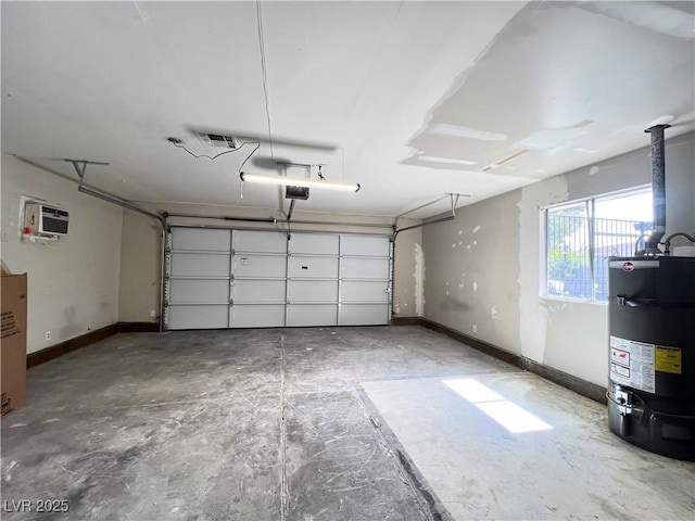 garage with a garage door opener, gas water heater, and baseboards