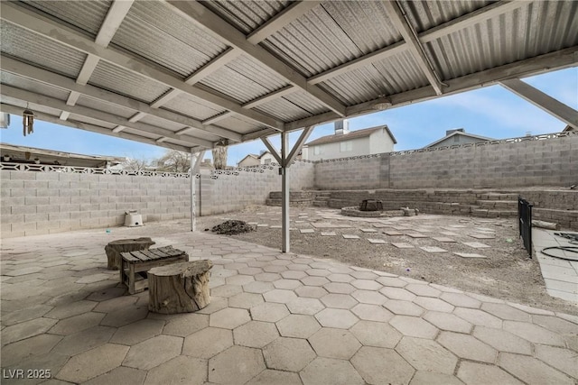 view of patio / terrace with a fire pit and a fenced backyard