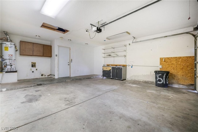 garage with a garage door opener and water heater