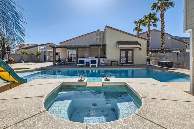 view of swimming pool featuring a fenced in pool, a patio, an in ground hot tub, fence, and french doors