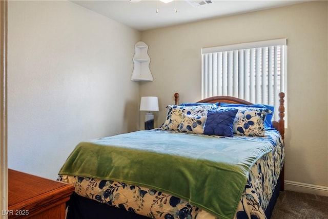 bedroom with baseboards and carpet flooring