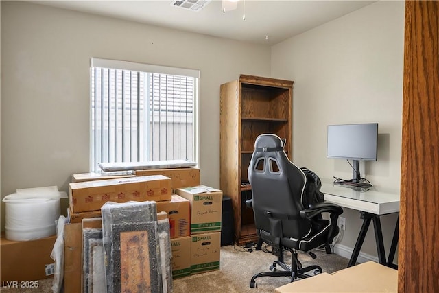 office area with baseboards, carpet, visible vents, and a ceiling fan