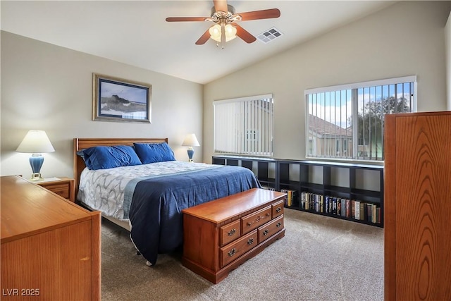 bedroom featuring ceiling fan, visible vents, vaulted ceiling, and carpet flooring