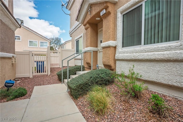 view of side of home with fence