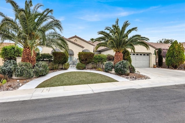 view of front of home with driveway, a garage, and stucco siding