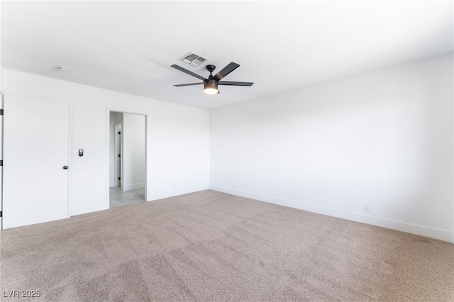 unfurnished bedroom with baseboards, carpet floors, visible vents, and a ceiling fan