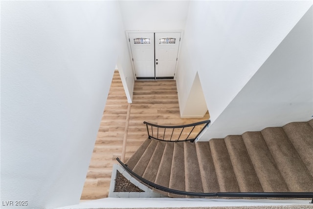 stairway with wood finished floors