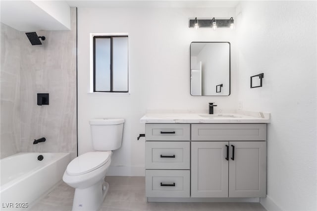 bathroom featuring baseboards, tub / shower combination, vanity, and toilet