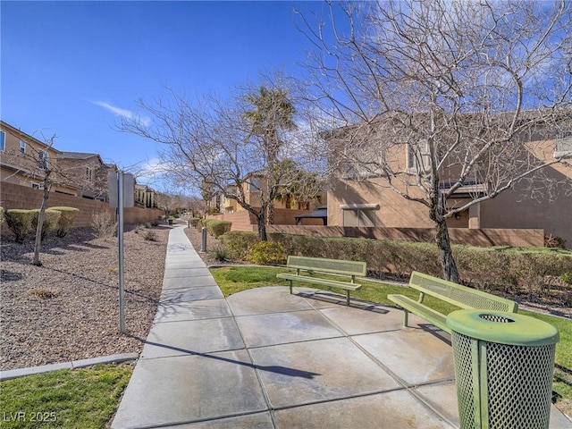 view of home's community featuring a residential view and a patio