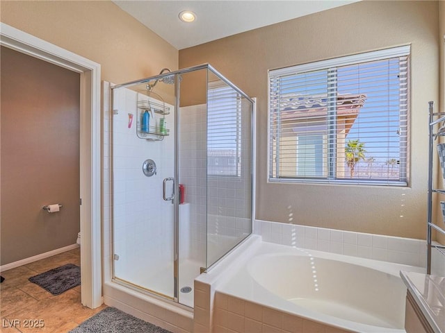 full bath with a stall shower, tile patterned flooring, a garden tub, and toilet