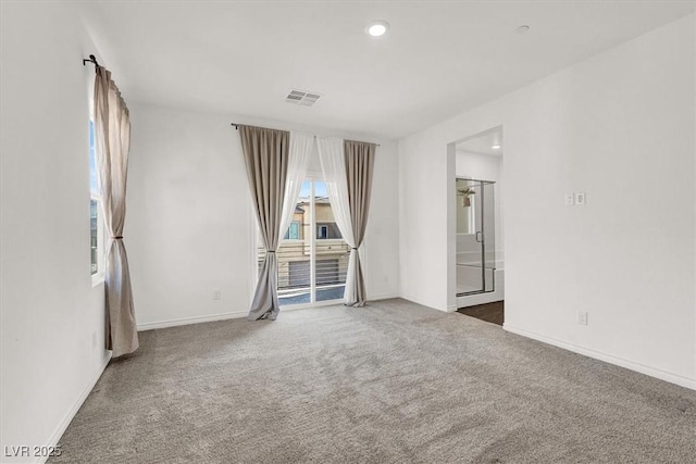 carpeted spare room with recessed lighting, visible vents, and baseboards