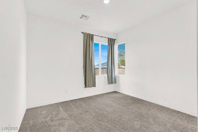 unfurnished room featuring recessed lighting, visible vents, dark carpet, and baseboards