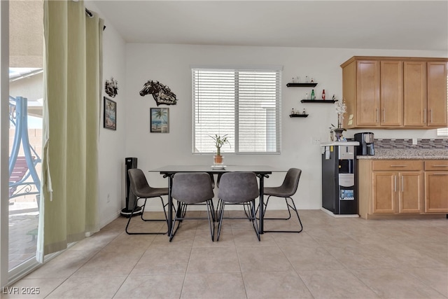 dining area featuring light tile patterned floors