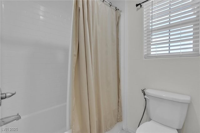 full bathroom featuring shower / bath combination with curtain and toilet