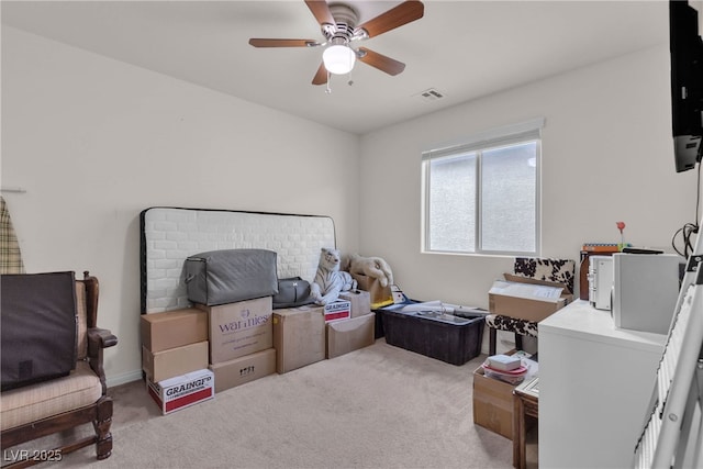 interior space featuring ceiling fan and visible vents