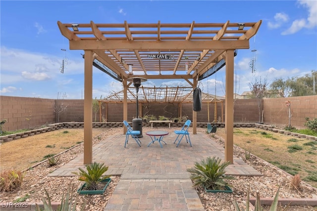 view of patio / terrace featuring a fenced backyard and a pergola