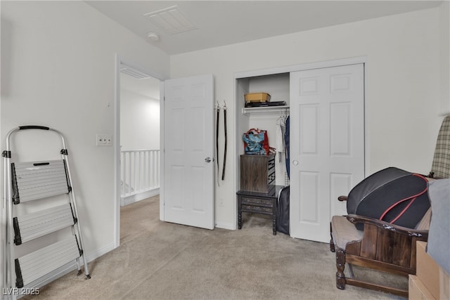 bedroom with baseboards, a closet, visible vents, and light colored carpet